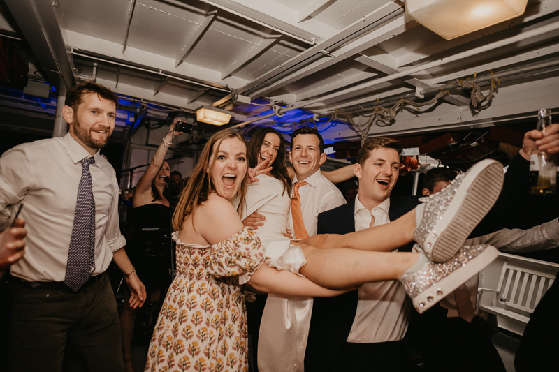 An exciting evening wedding reception by Watershed Entertainment and Timmie Metz Band on the Harbor Queen boat in Annapolis, Maryland by Britney Clause Photography