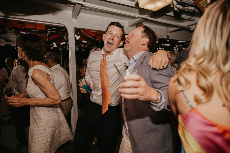 An exciting evening wedding reception by Watershed Entertainment and Timmie Metz Band on the Harbor Queen boat in Annapolis, Maryland by Britney Clause Photography