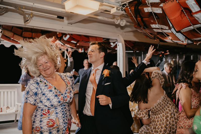 An exciting evening wedding reception by Watershed Entertainment and Timmie Metz Band on the Harbor Queen boat in Annapolis, Maryland by Britney Clause Photography