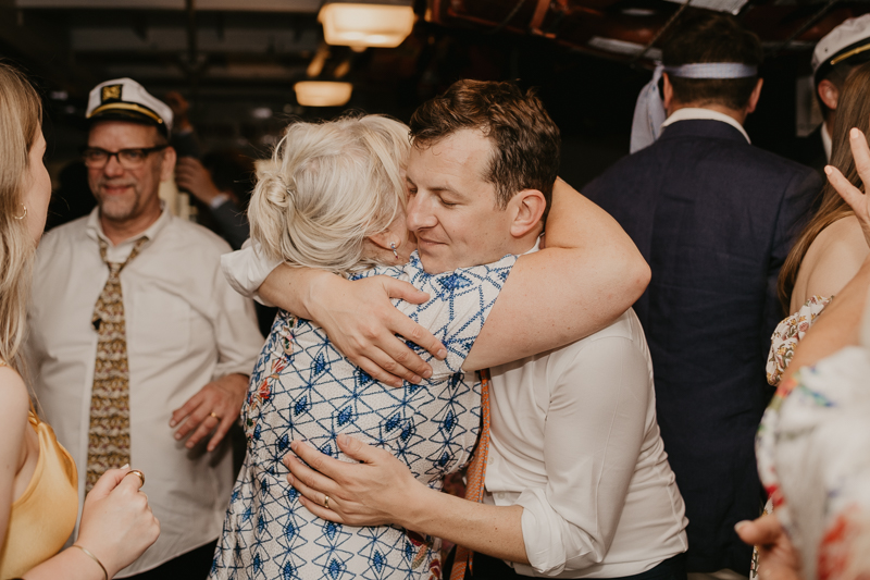 An exciting evening wedding reception by Watershed Entertainment and Timmie Metz Band on the Harbor Queen boat in Annapolis, Maryland by Britney Clause Photography