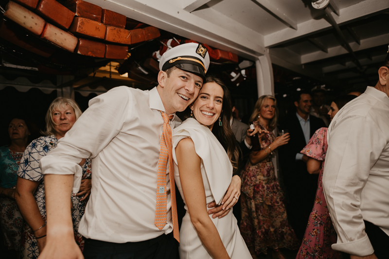 An exciting evening wedding reception by Watershed Entertainment and Timmie Metz Band on the Harbor Queen boat in Annapolis, Maryland by Britney Clause Photography