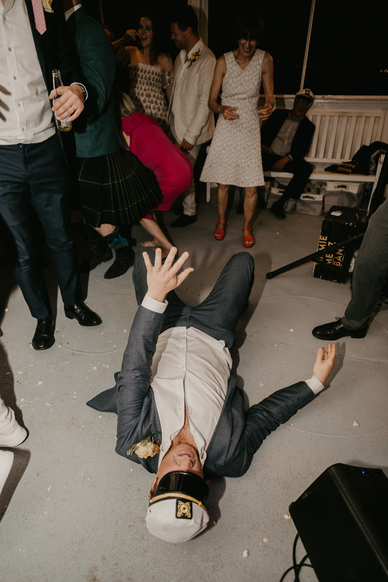 An exciting evening wedding reception by Watershed Entertainment and Timmie Metz Band on the Harbor Queen boat in Annapolis, Maryland by Britney Clause Photography