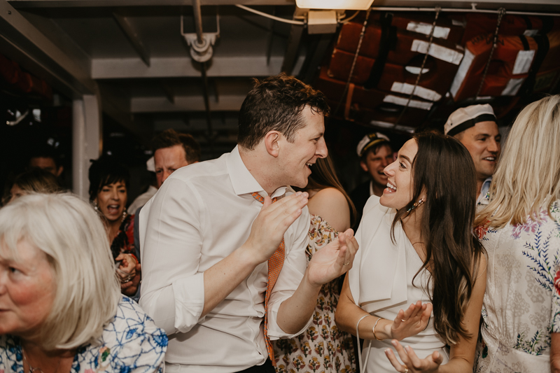 An exciting evening wedding reception by Watershed Entertainment and Timmie Metz Band on the Harbor Queen boat in Annapolis, Maryland by Britney Clause Photography