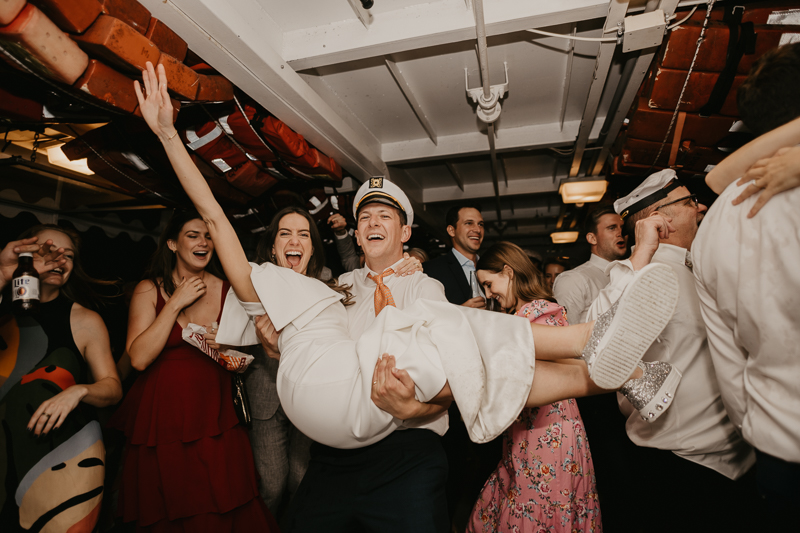 An exciting evening wedding reception by Watershed Entertainment and Timmie Metz Band on the Harbor Queen boat in Annapolis, Maryland by Britney Clause Photography