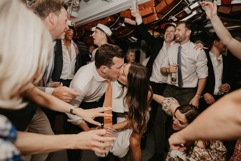 An exciting evening wedding reception by Watershed Entertainment and Timmie Metz Band on the Harbor Queen boat in Annapolis, Maryland by Britney Clause Photography