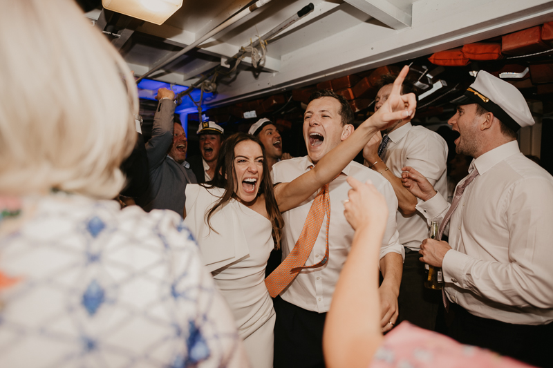 An exciting evening wedding reception by Watershed Entertainment and Timmie Metz Band on the Harbor Queen boat in Annapolis, Maryland by Britney Clause Photography