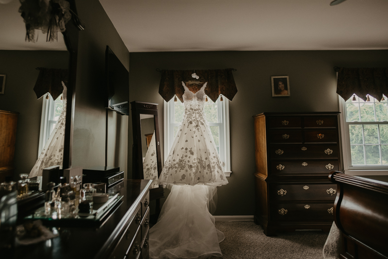 A stunning Essense of Australia wedding dress from The Bridal Boutique Columbia at a private residence for an Ellicott City, Maryland wedding by Britney Clause Photography