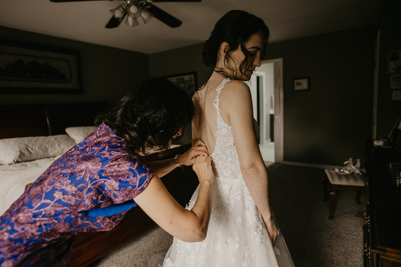 A bride getting ready at a private residence for an Ellicott City, Maryland wedding by Britney Clause Photography