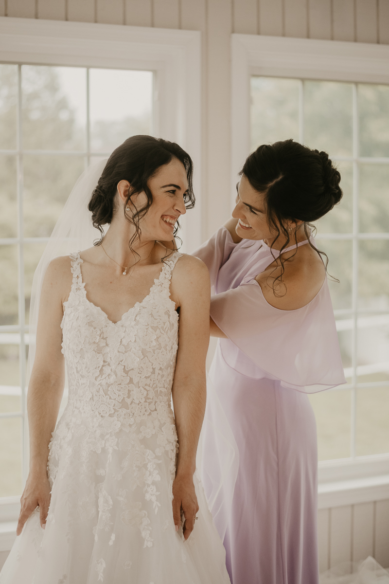 A bride getting ready at a private residence for an Ellicott City, Maryland wedding by Britney Clause Photography