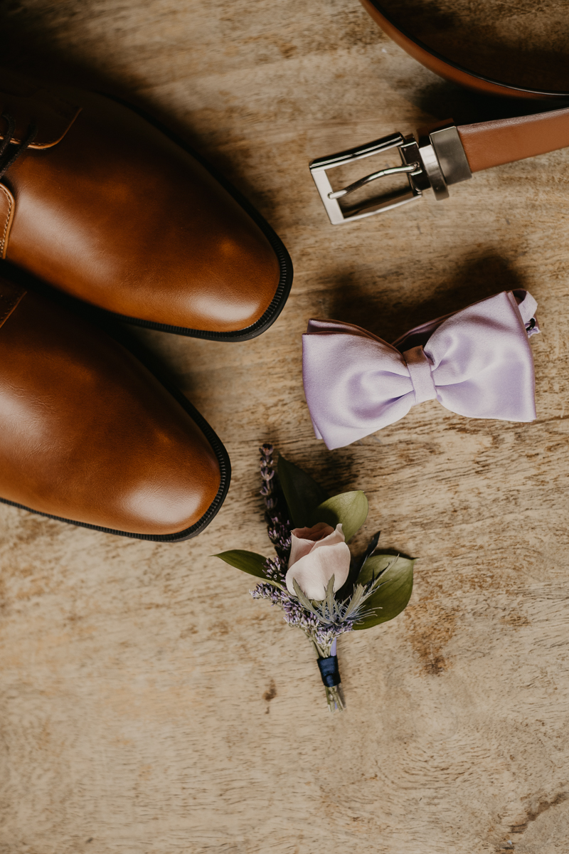 A groom getting ready at Main Street Ballroom in Ellicott City, Maryland by Britney Clause Photography