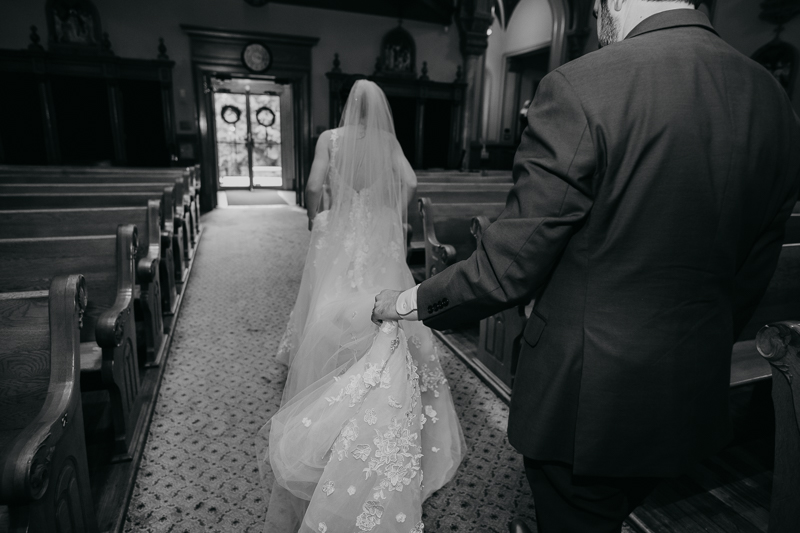 Beautiful bride and groom portraits at St. Augustine Church in Elkridge, Maryland by Britney Clause Photography