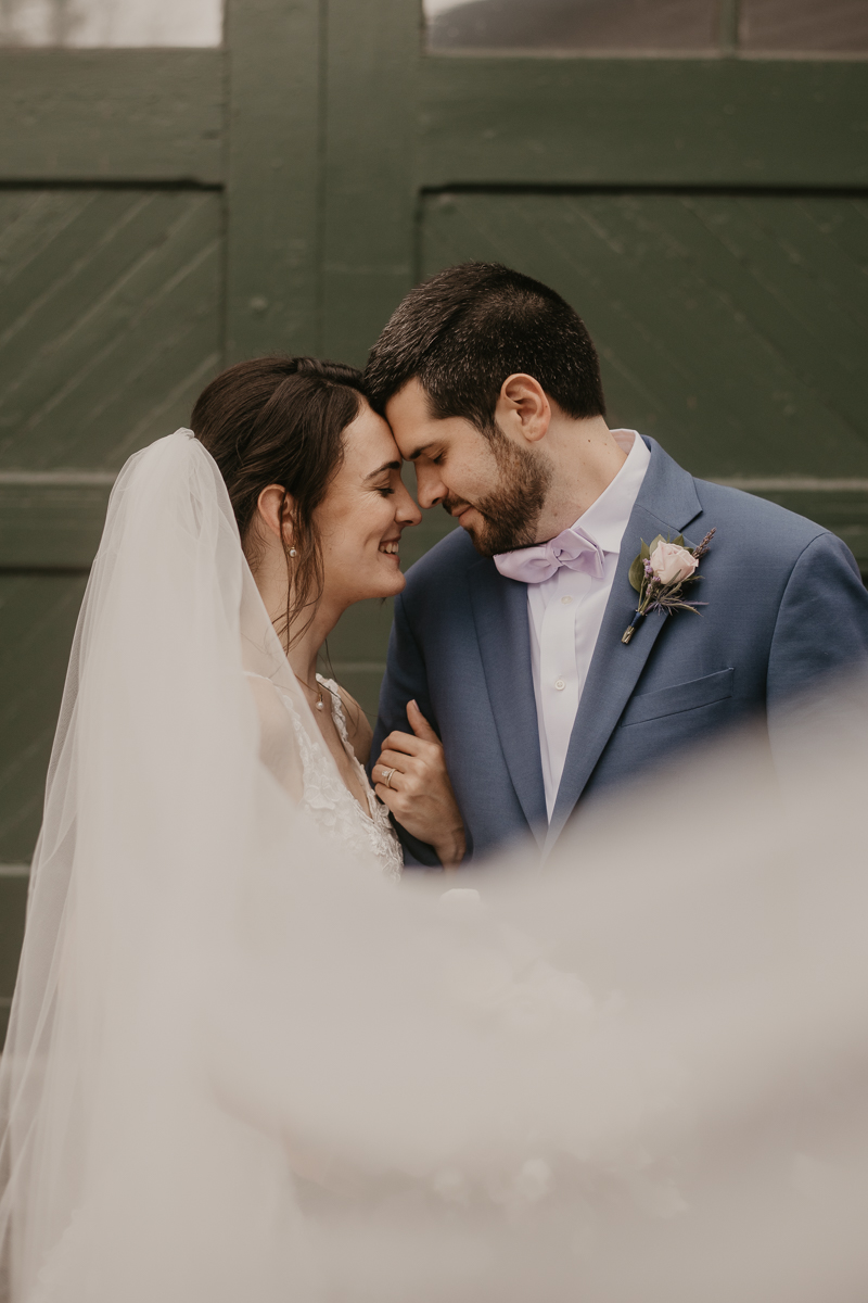 Stunning bride and groom wedding portraits at Main Street Ballroom in Ellicott City, Maryland by Britney Clause Photography