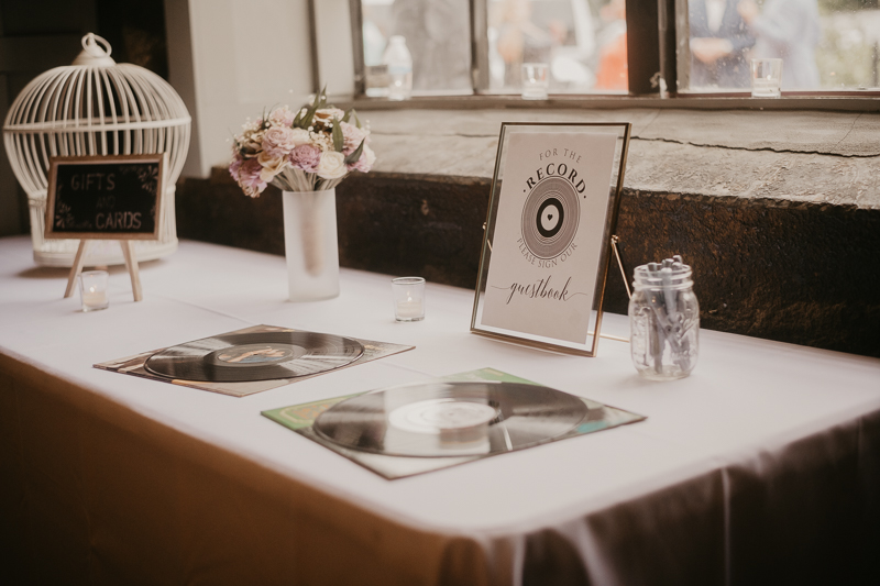 Gorgeous industrial wedding reception decor at Main Street Ballroom in Ellicott City, Maryland by Britney Clause Photography