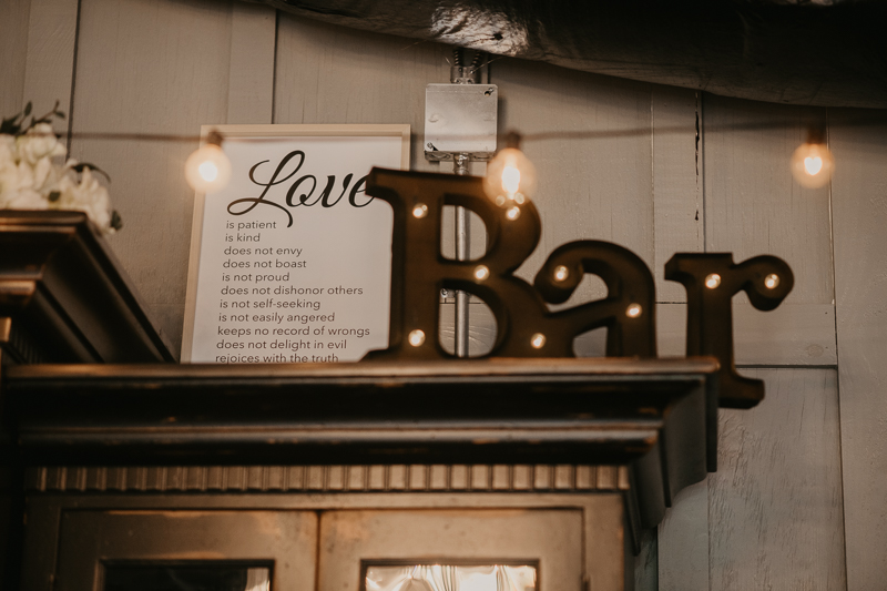 Gorgeous industrial wedding reception decor at Main Street Ballroom in Ellicott City, Maryland by Britney Clause Photography