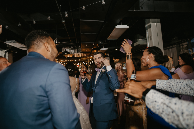 An exciting evening wedding reception by DJ Drew Albins from BMore for the Record at Main Street Ballroom in Ellicott City, Maryland by Britney Clause Photography