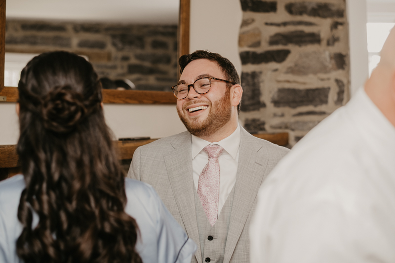 A groom getting ready at Dulany's Overlook in Frederick, Maryland by Britney Clause Photography