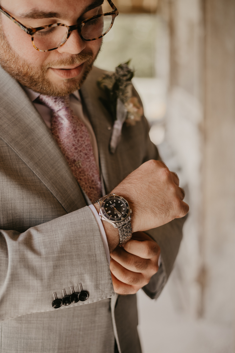 A groom getting ready at Dulany's Overlook in Frederick, Maryland by Britney Clause Photography