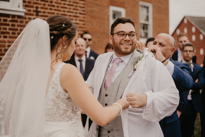 A lively Ketubah signing in the Dulany's Overlook Rose Garden in Frederick, Maryland by Britney Clause Photography