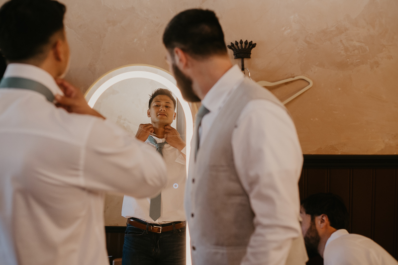 A groom getting ready at Castle Farm in Snow Hill, Maryland by Britney Clause Photography