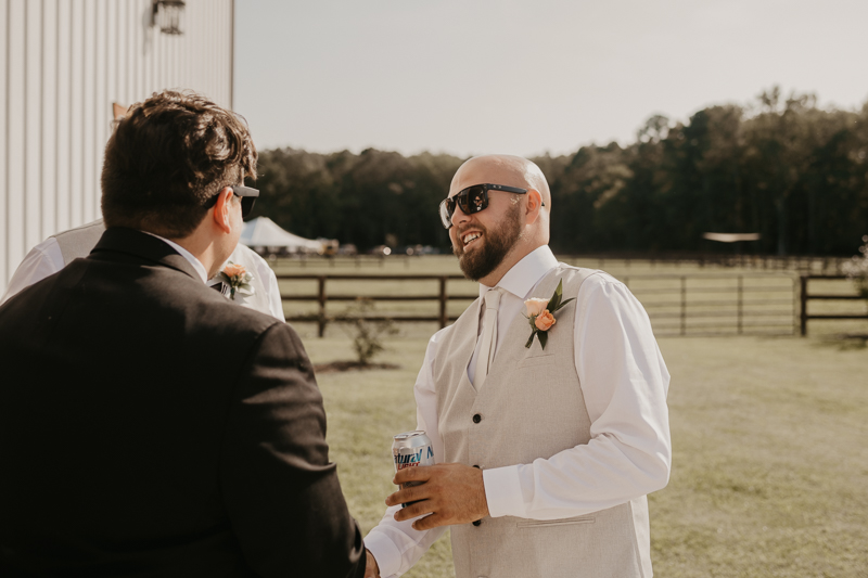 A groom getting ready at Castle Farm in Snow Hill, Maryland by Britney Clause Photography