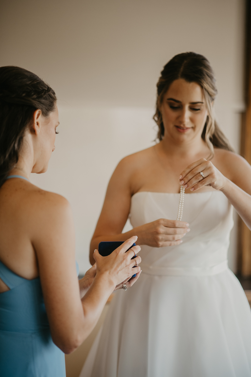 A bride getting ready at the Chesapeake Bay Foundation in Annapolis Maryland by Britney Clause Photography