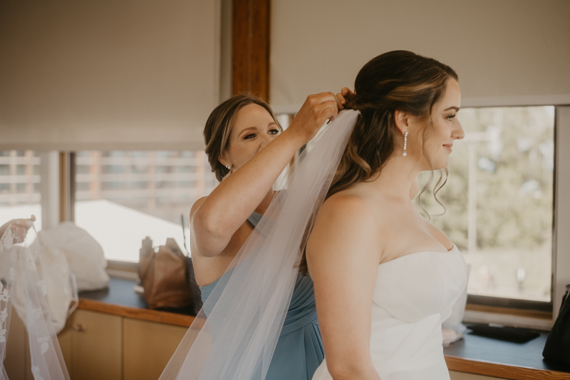 A bride getting ready at the Chesapeake Bay Foundation in Annapolis Maryland by Britney Clause Photography