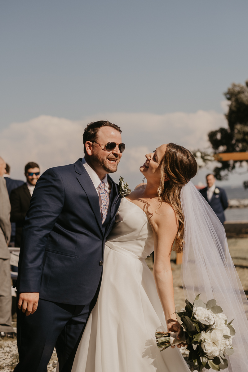 Amazing summer waterfront wedding ceremony at the Chesapeake Bay Foundation in Annapolis Maryland by Britney Clause Photography