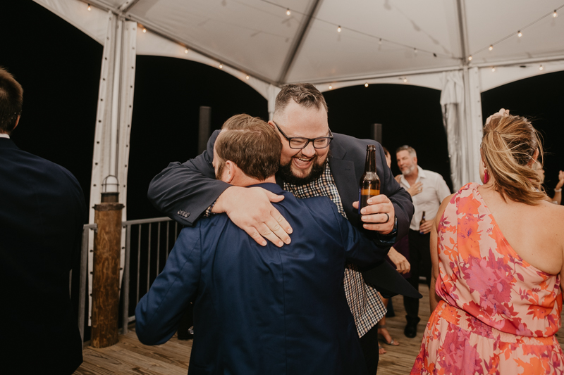 An exciting evening wedding reception by DJ Premonition from Mixing Maryland at the Chesapeake Bay Foundation in Annapolis Maryland by Britney Clause Photography