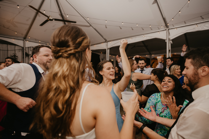 An exciting evening wedding reception by DJ Premonition from Mixing Maryland at the Chesapeake Bay Foundation in Annapolis Maryland by Britney Clause Photography