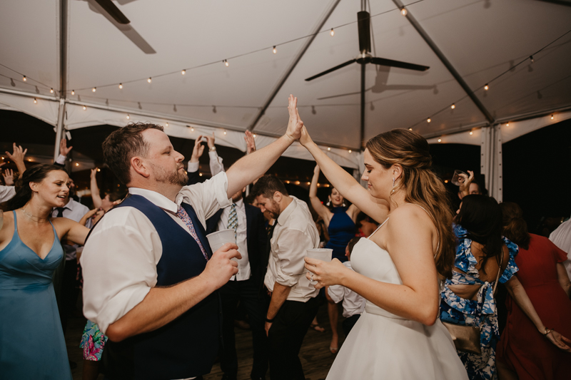 An exciting evening wedding reception by DJ Premonition from Mixing Maryland at the Chesapeake Bay Foundation in Annapolis Maryland by Britney Clause Photography