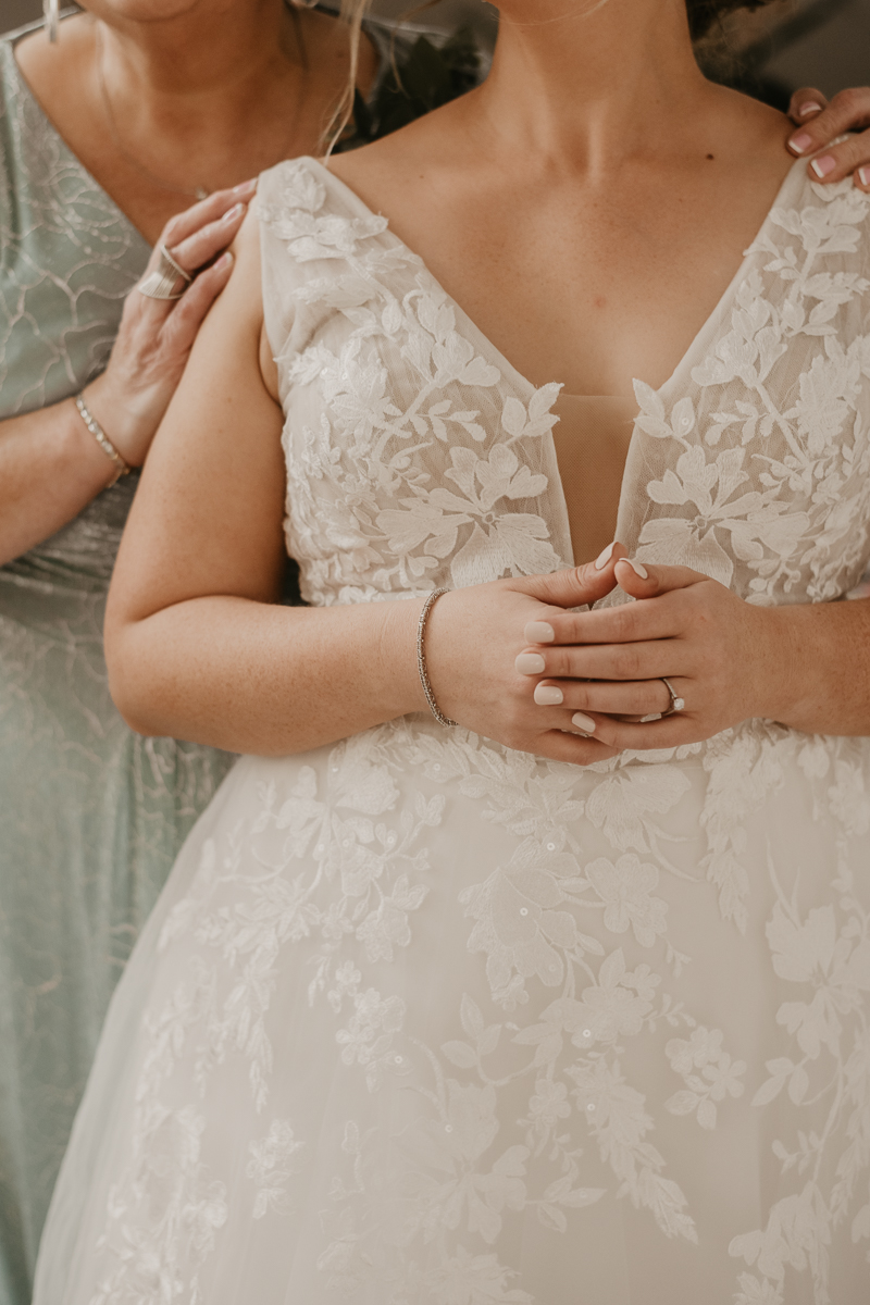 A bride getting ready for her wedding at Celebrations at the Bay in Pasadena, Maryland by Britney Clause Photography