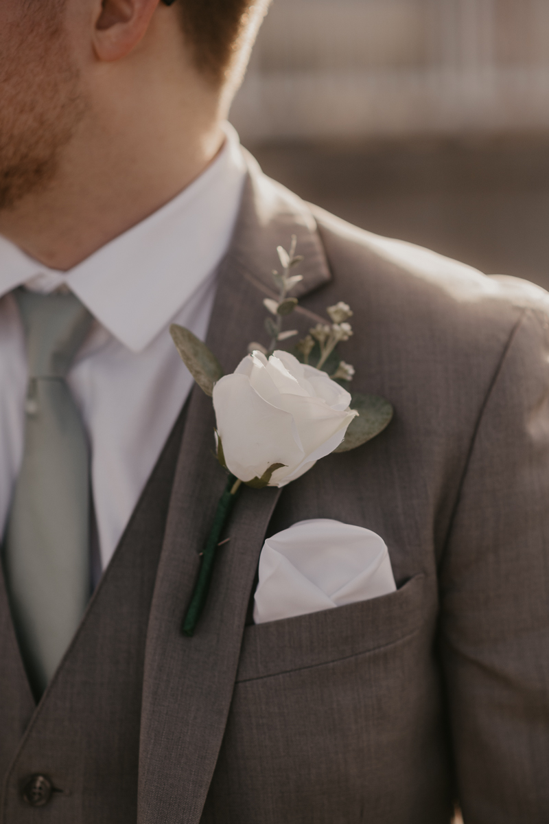 A groom getting ready for his wedding at Celebrations at the Bay in Pasadena, Maryland by Britney Clause Photography