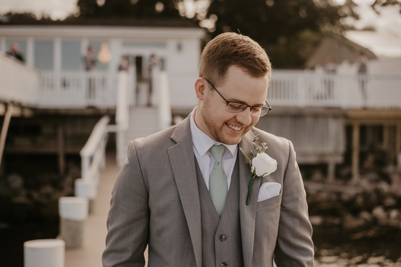 A groom getting ready for his wedding at Celebrations at the Bay in Pasadena, Maryland by Britney Clause Photography