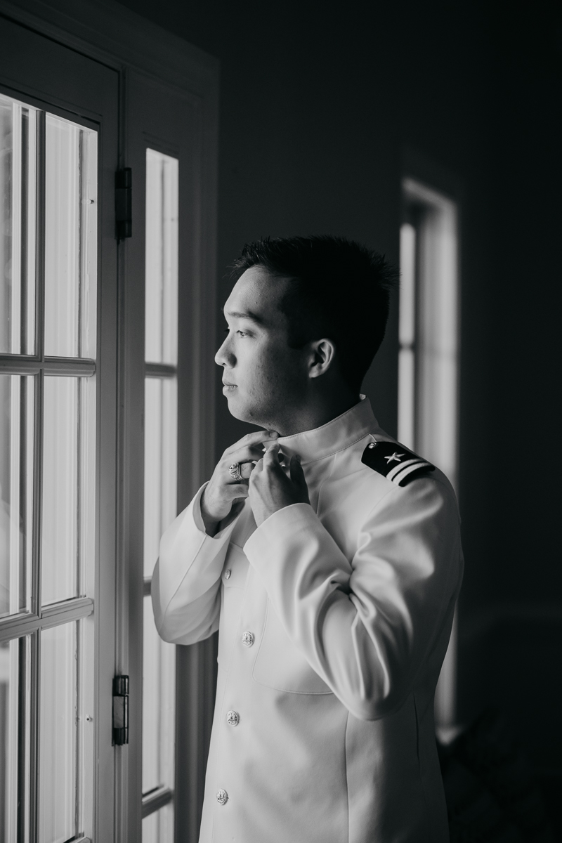 A groom getting ready at Rose Hill Manor in Leesburg, Virginia by Britney Clause Photography