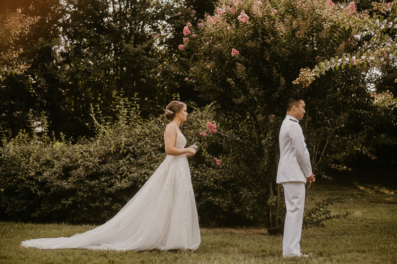 A beautiful first look between a bride and groom at Rose Hill Manor in Leesburg, Virginia by Britney Clause Photography