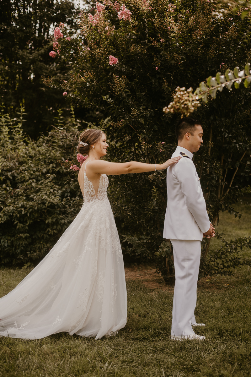 A beautiful first look between a bride and groom at Rose Hill Manor in Leesburg, Virginia by Britney Clause Photography