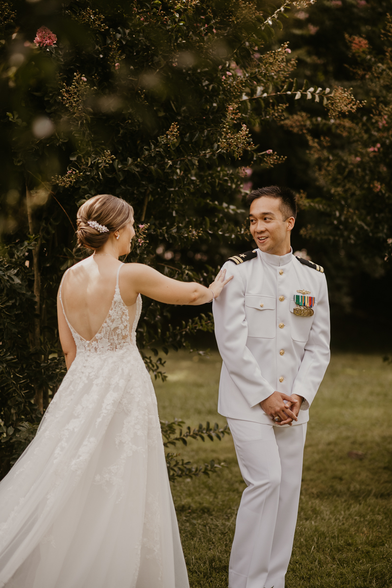 A beautiful first look between a bride and groom at Rose Hill Manor in Leesburg, Virginia by Britney Clause Photography