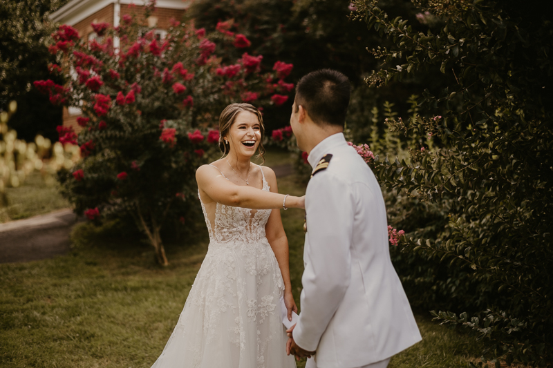 A beautiful first look between a bride and groom at Rose Hill Manor in Leesburg, Virginia by Britney Clause Photography