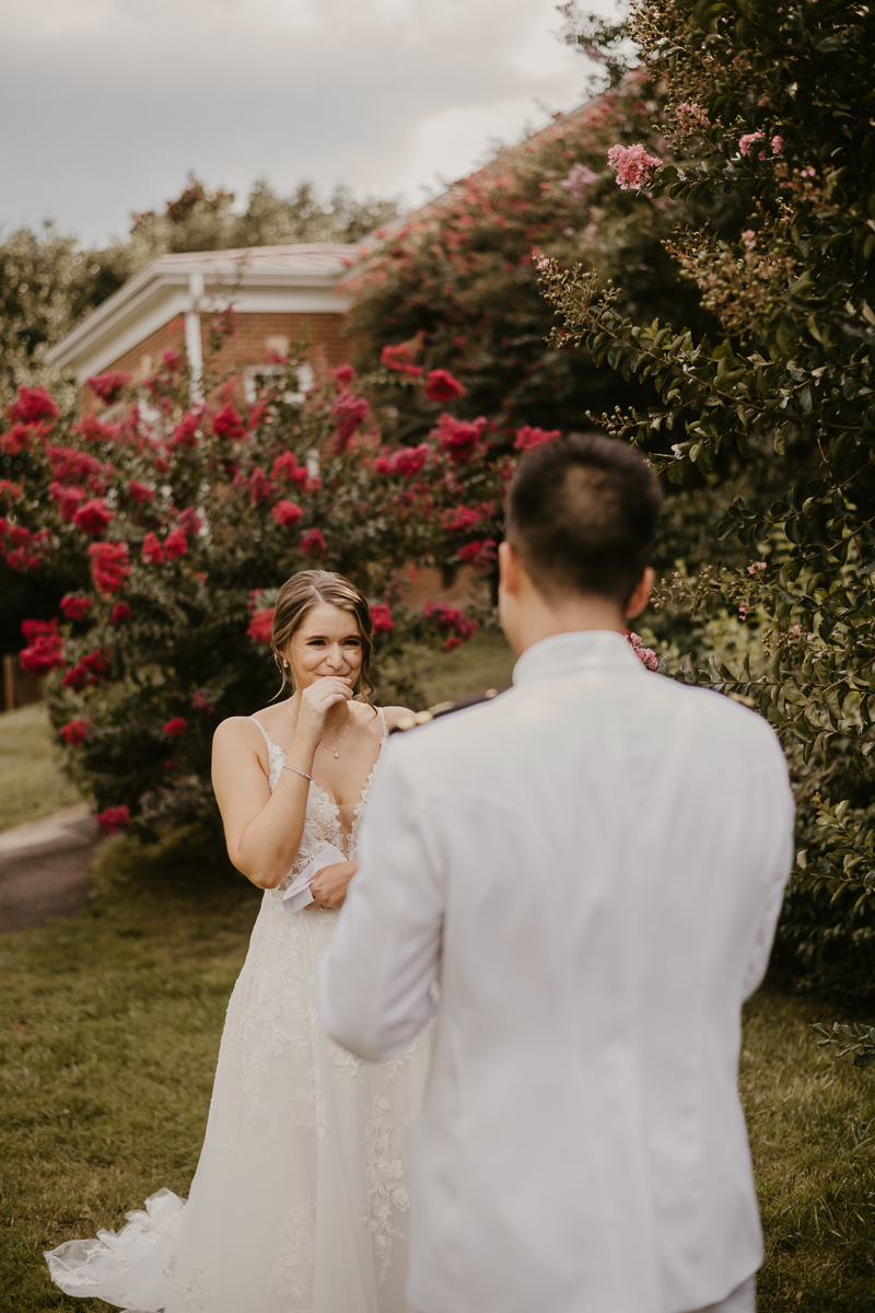 A beautiful first look between a bride and groom at Rose Hill Manor in Leesburg, Virginia by Britney Clause Photography