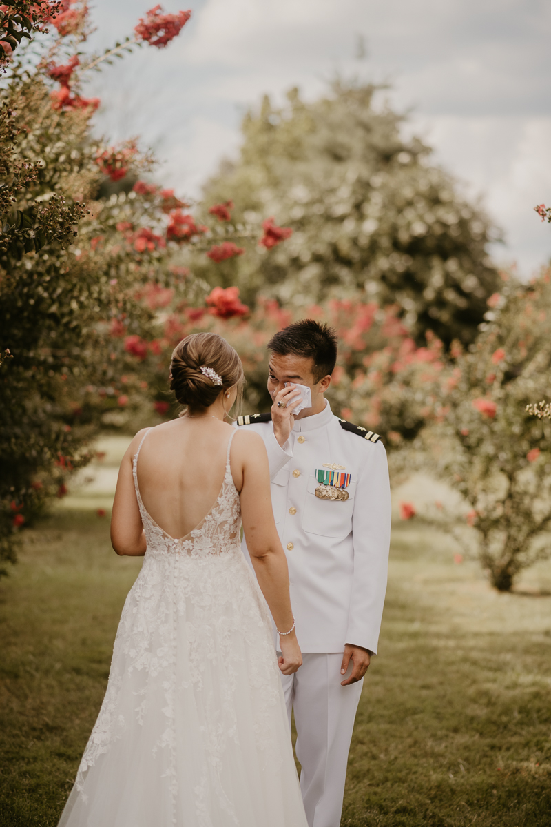 A beautiful first look between a bride and groom at Rose Hill Manor in Leesburg, Virginia by Britney Clause Photography