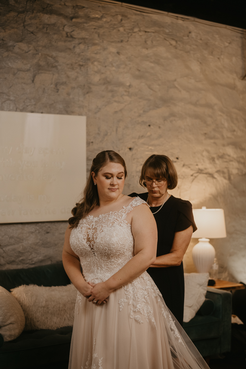 A bride getting ready at Main Street Ballroom in Ellicott City, Maryland by Britney Clause Photography