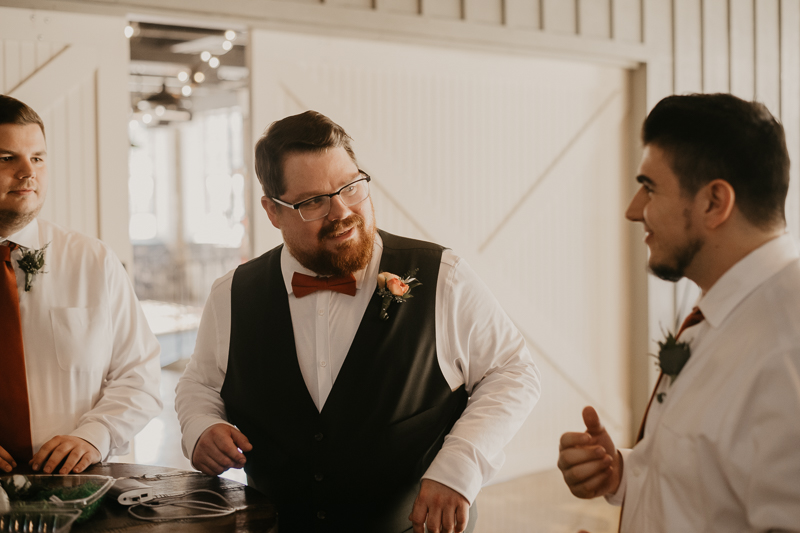 A groom getting ready at Main Street Ballroom in Ellicott City, Maryland by Britney Clause Photography