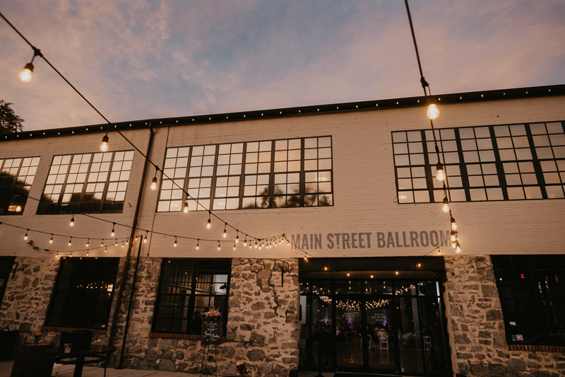 Gorgeous industrial wedding reception decor at Main Street Ballroom in Ellicott City, Maryland by Britney Clause Photography