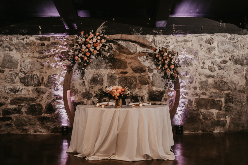 Gorgeous industrial wedding reception decor at Main Street Ballroom in Ellicott City, Maryland by Britney Clause Photography