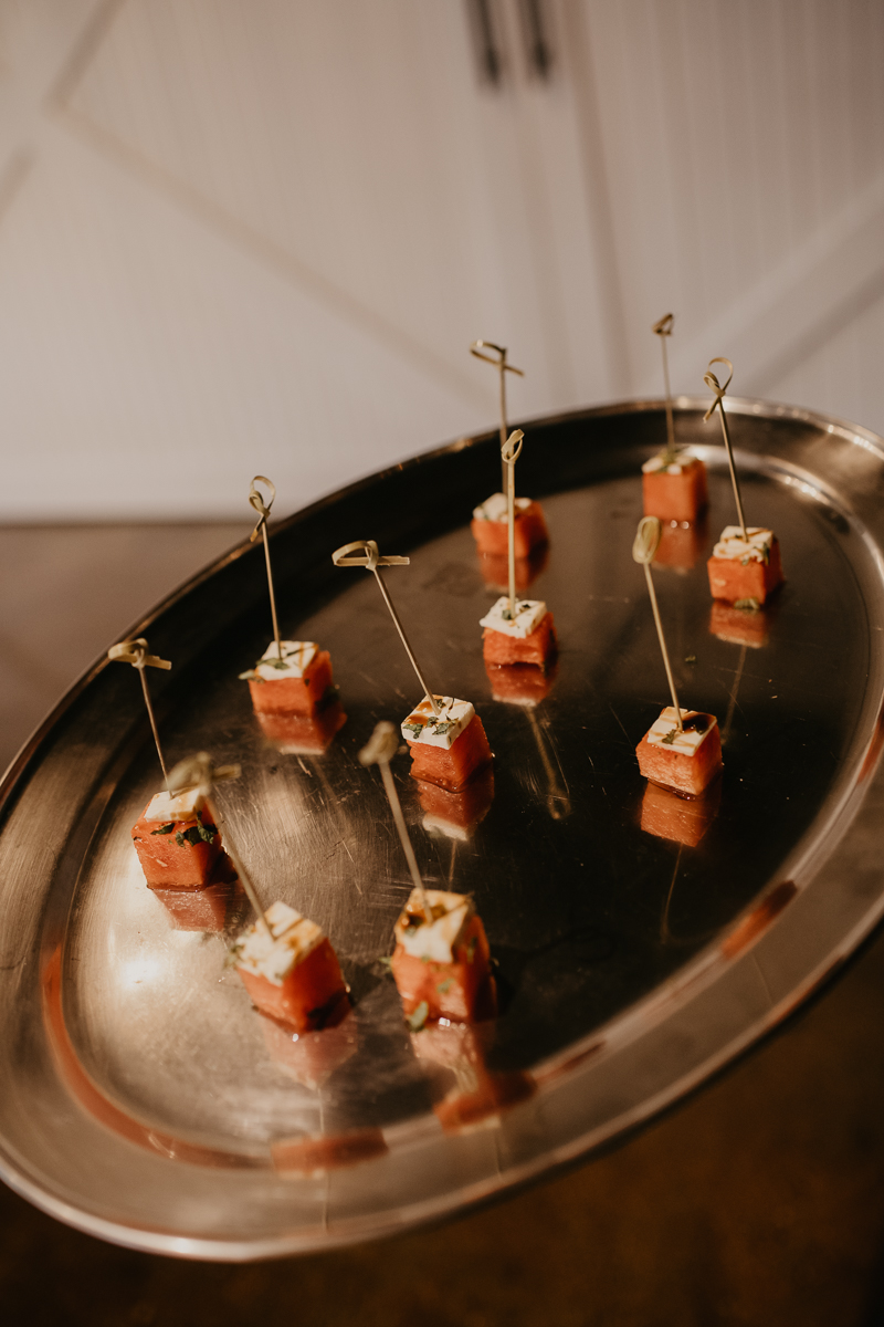 Gorgeous industrial wedding reception decor at Main Street Ballroom in Ellicott City, Maryland by Britney Clause Photography