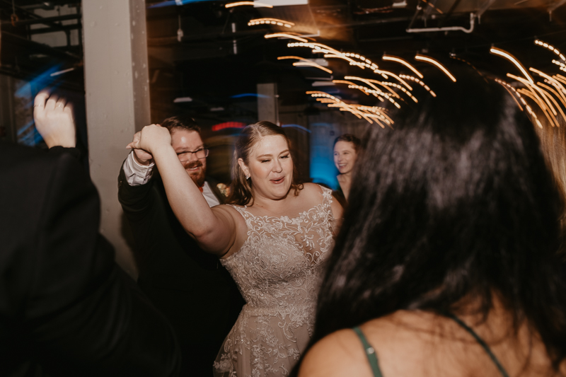 An exciting evening wedding reception by DJ Black Wizard at Main Street Ballroom in Ellicott City, Maryland by Britney Clause Photography