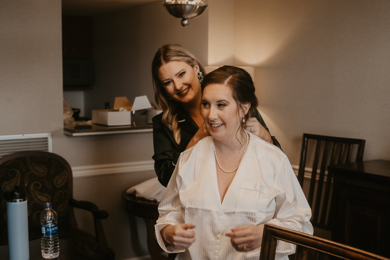 A bride getting ready at the Double Tree Hilton Hotel Baltimore for a Mt. Washington Mill Dye House in Baltimore, Maryland by Britney Clause Photography
