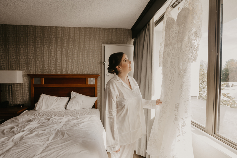 A bride getting ready at the Double Tree Hilton Hotel Baltimore for a Mt. Washington Mill Dye House in Baltimore, Maryland by Britney Clause Photography