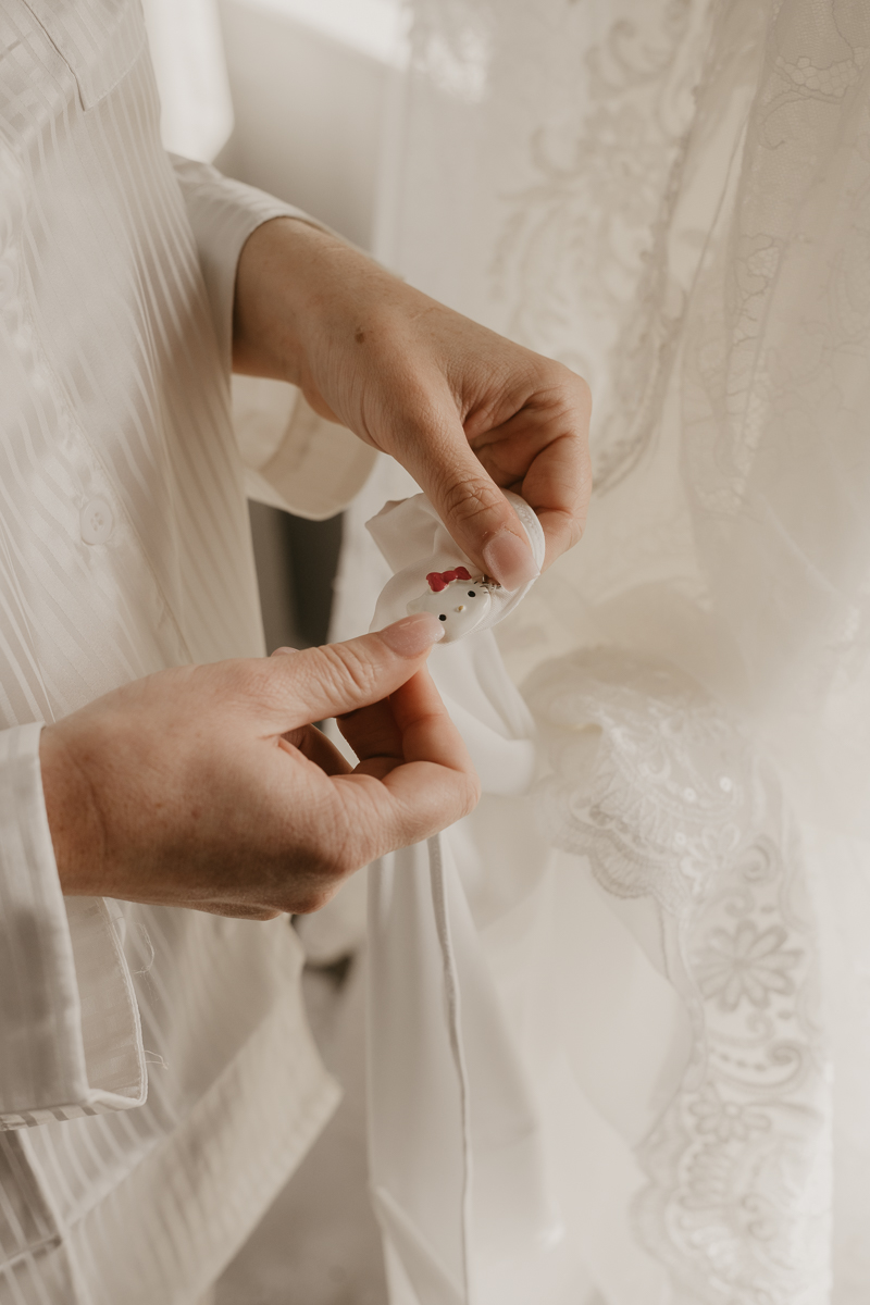 A bride getting ready at the Double Tree Hilton Hotel Baltimore for a Mt. Washington Mill Dye House in Baltimore, Maryland by Britney Clause Photography