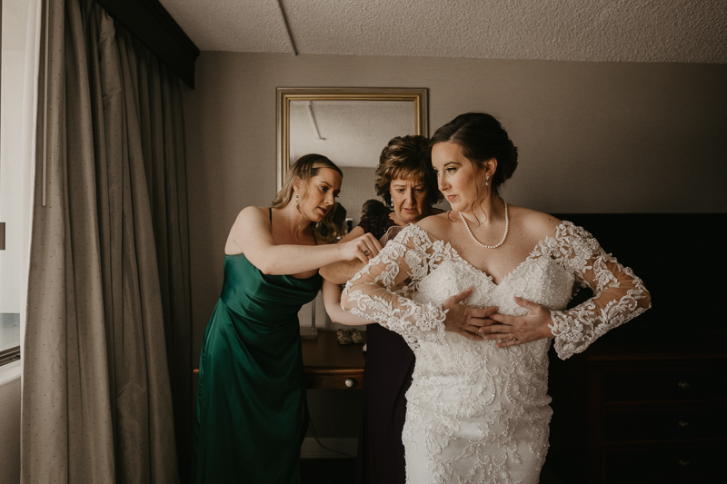 A bride getting ready at the Double Tree Hilton Hotel Baltimore for a Mt. Washington Mill Dye House in Baltimore, Maryland by Britney Clause Photography
